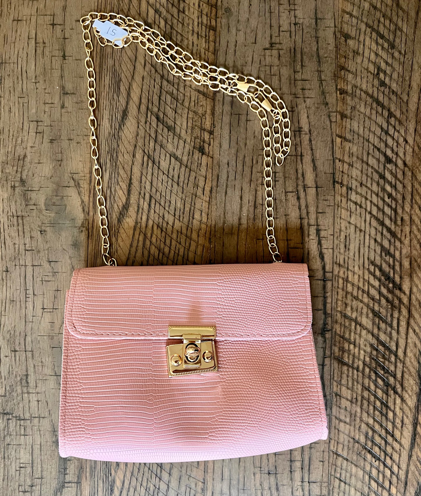 Pink purse with gold chain strap