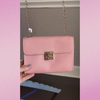 Pink purse with gold chain strap