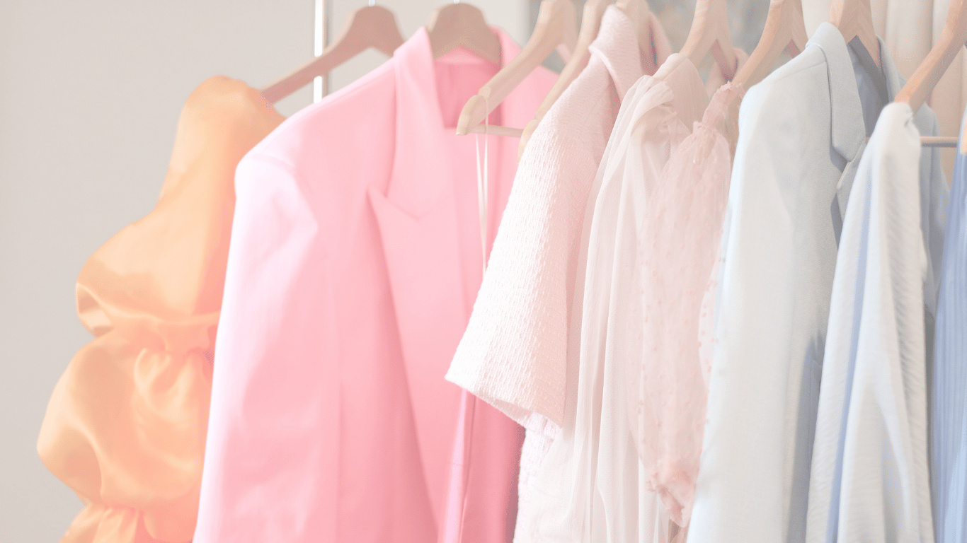 Rack of solid color blouses on hangers